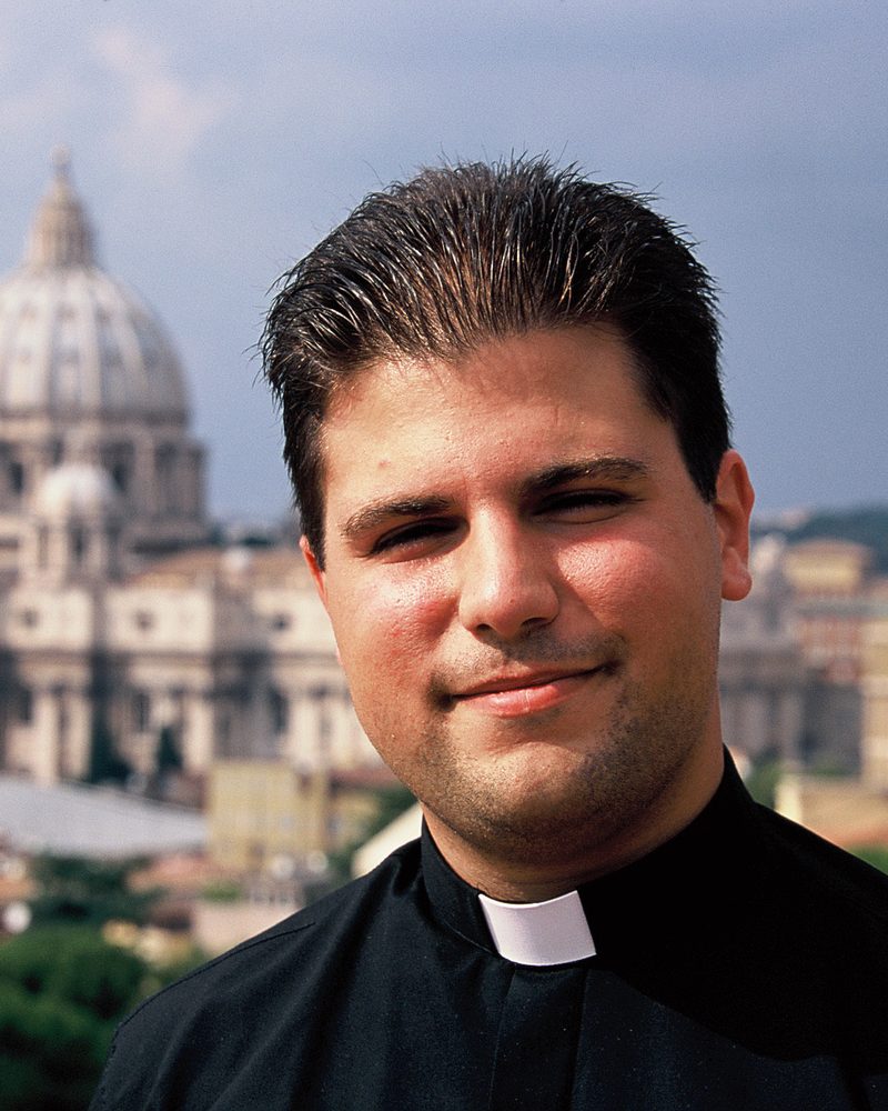 Fr. De Rosa in Rome, with St. Peter's Basilica behind him